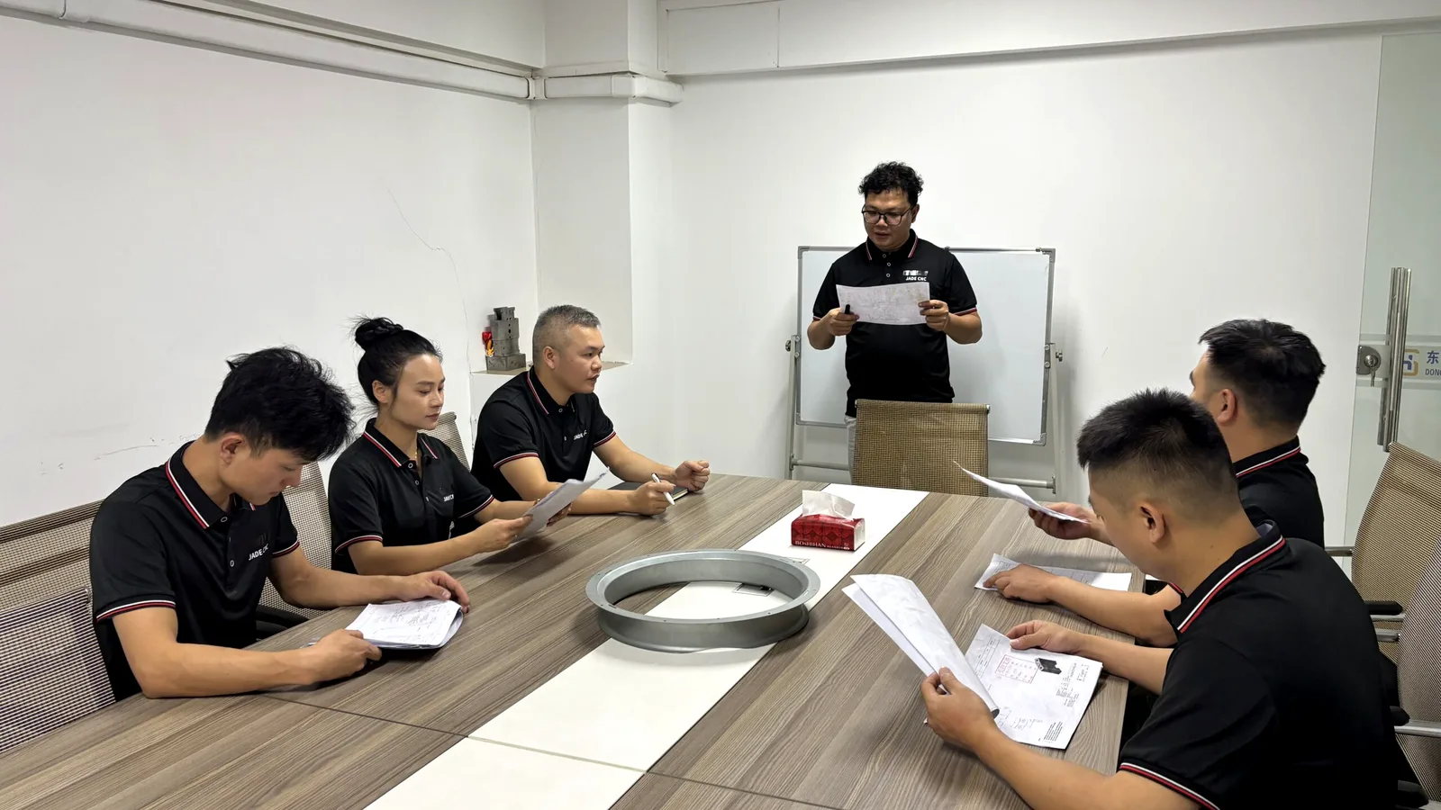 Engineering meeting for custom CNC machining project support