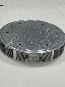 Large CNC machining part made from metal, shown during inspection after precision machining-bottom view
