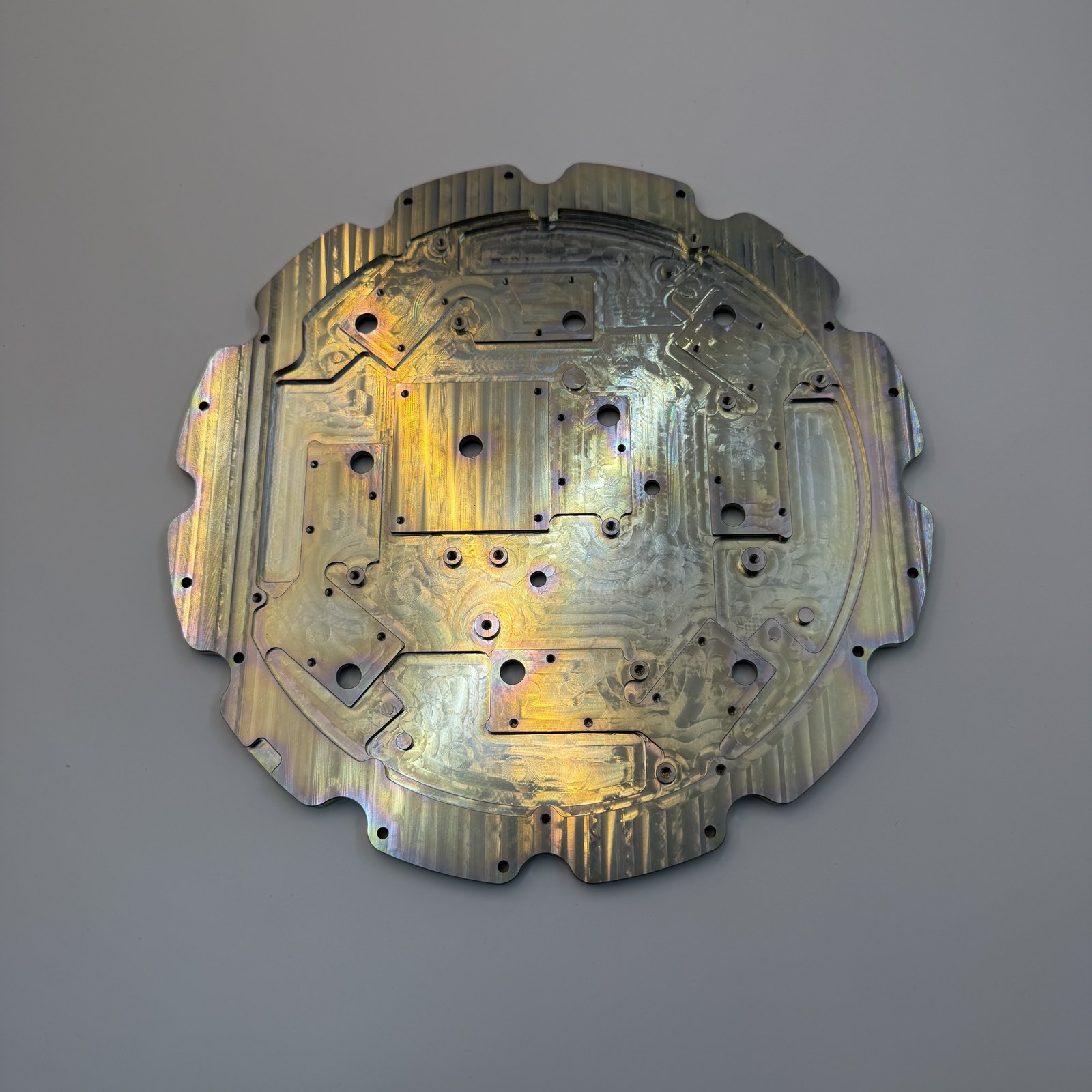 JADE-CNC sample-library photo of a CNC machined metal plate for material selection review