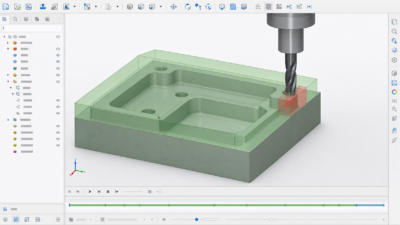 Pantalla del software de simulación de mecanizado que muestra un bloque de material verde translúcido cortado por una fresadora, con un área roja transparente de riesgo de colisión cerca de una esquina
