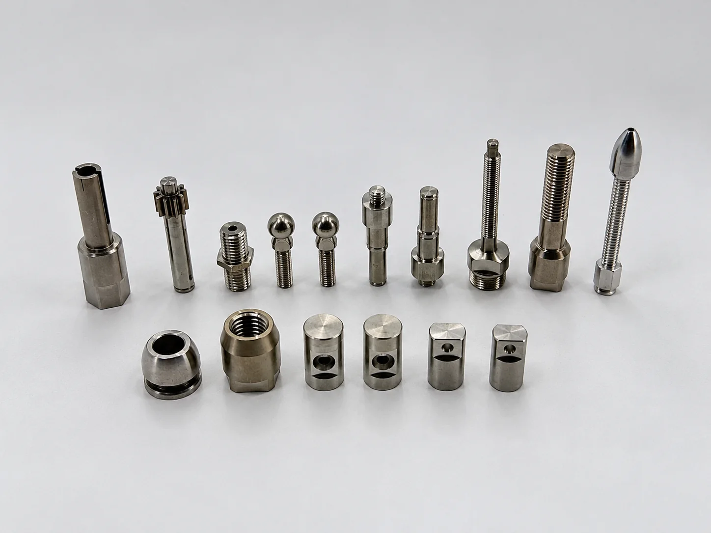 Arranged display of CNC turned parts with different sizes and thread features