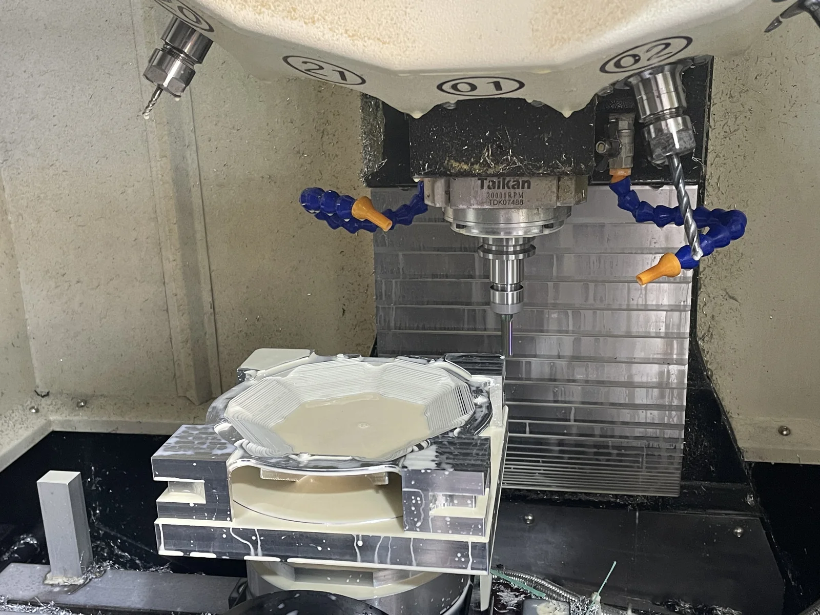 Precision communication component being cut on a five-axis CNC machine