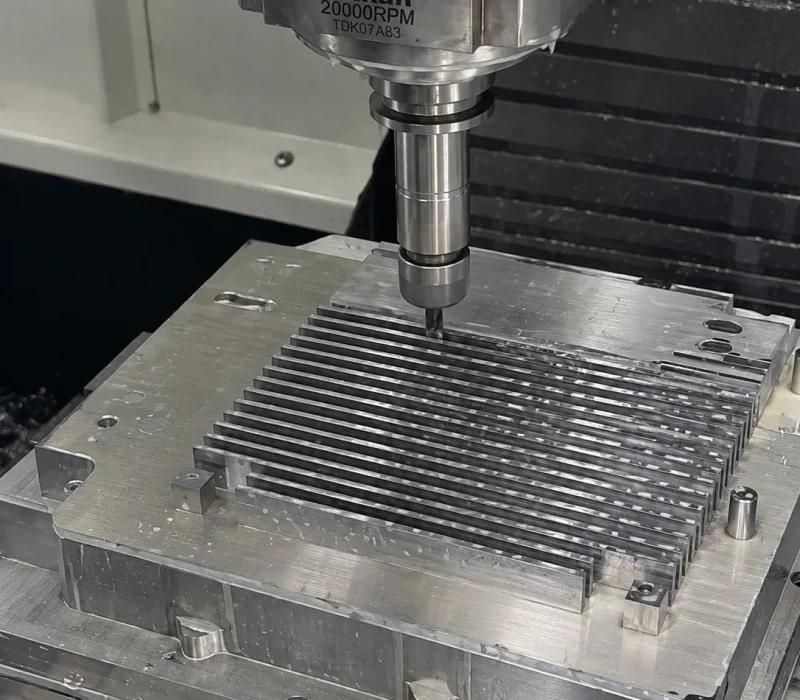 Heat sink being machined on a CNC machine during milling